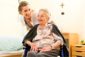 nurse assisting old lady with wheelchair